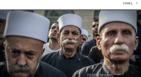 An image of Druze men from the 10th issue of IS' Dabiq magazine, with a caption disparaging them