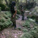 Two Libyan fighters in the lush forests of rural Latakia